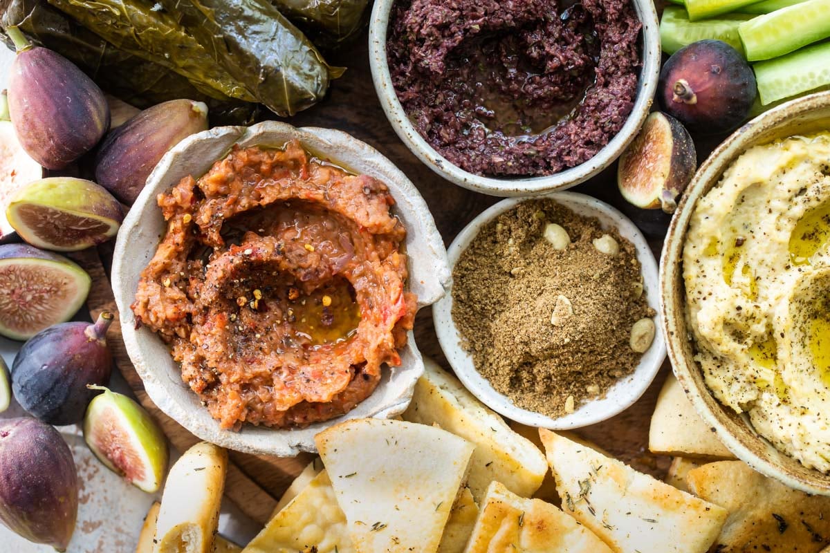 Mezze platter dips in bowls.