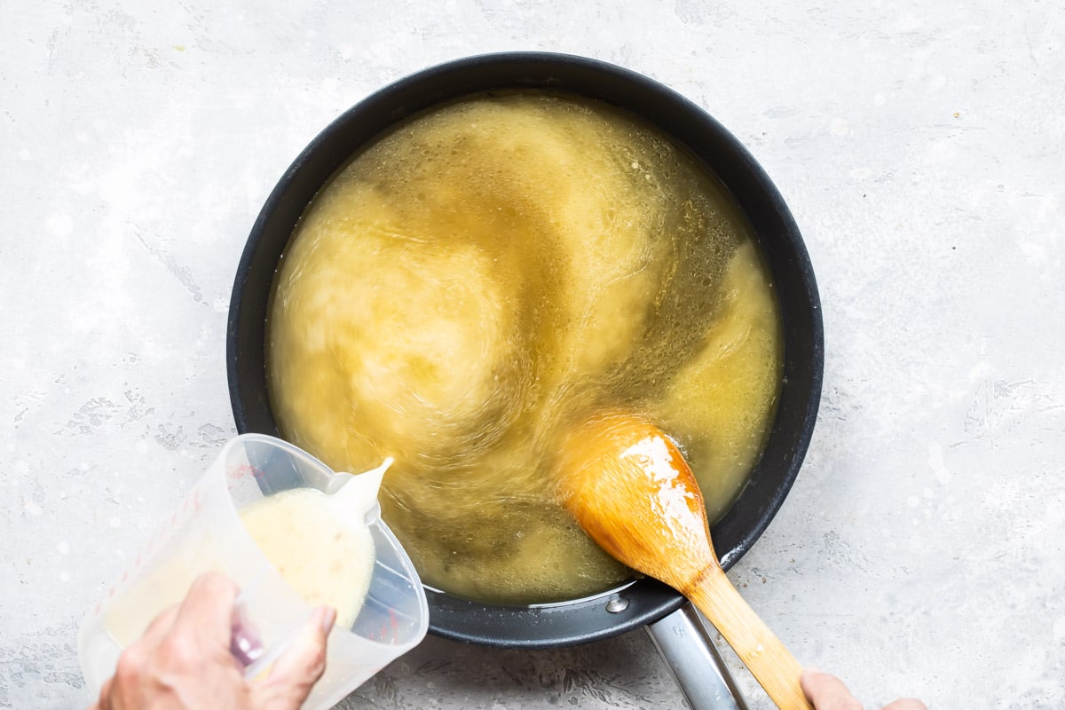 Thickening turkey gravy with a cornstarch slurry.