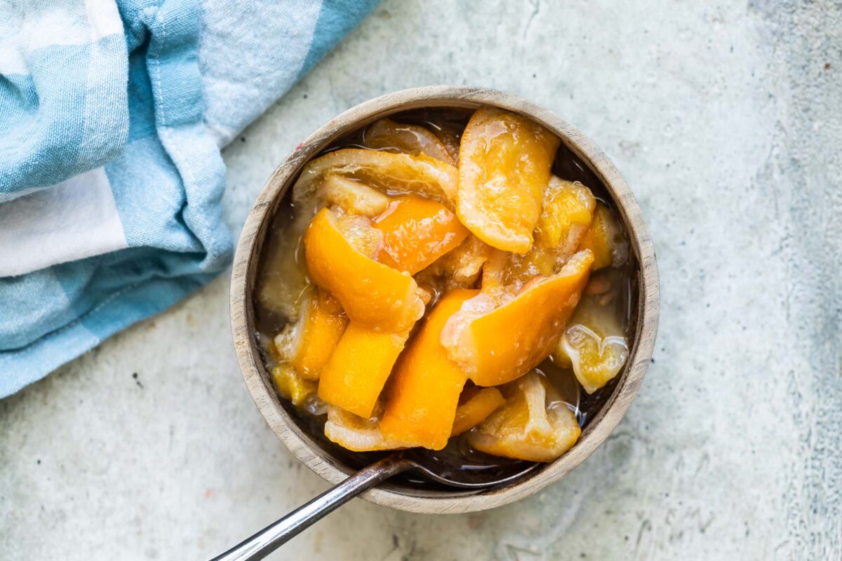 Preserved lemons in a bowl with a spoon.