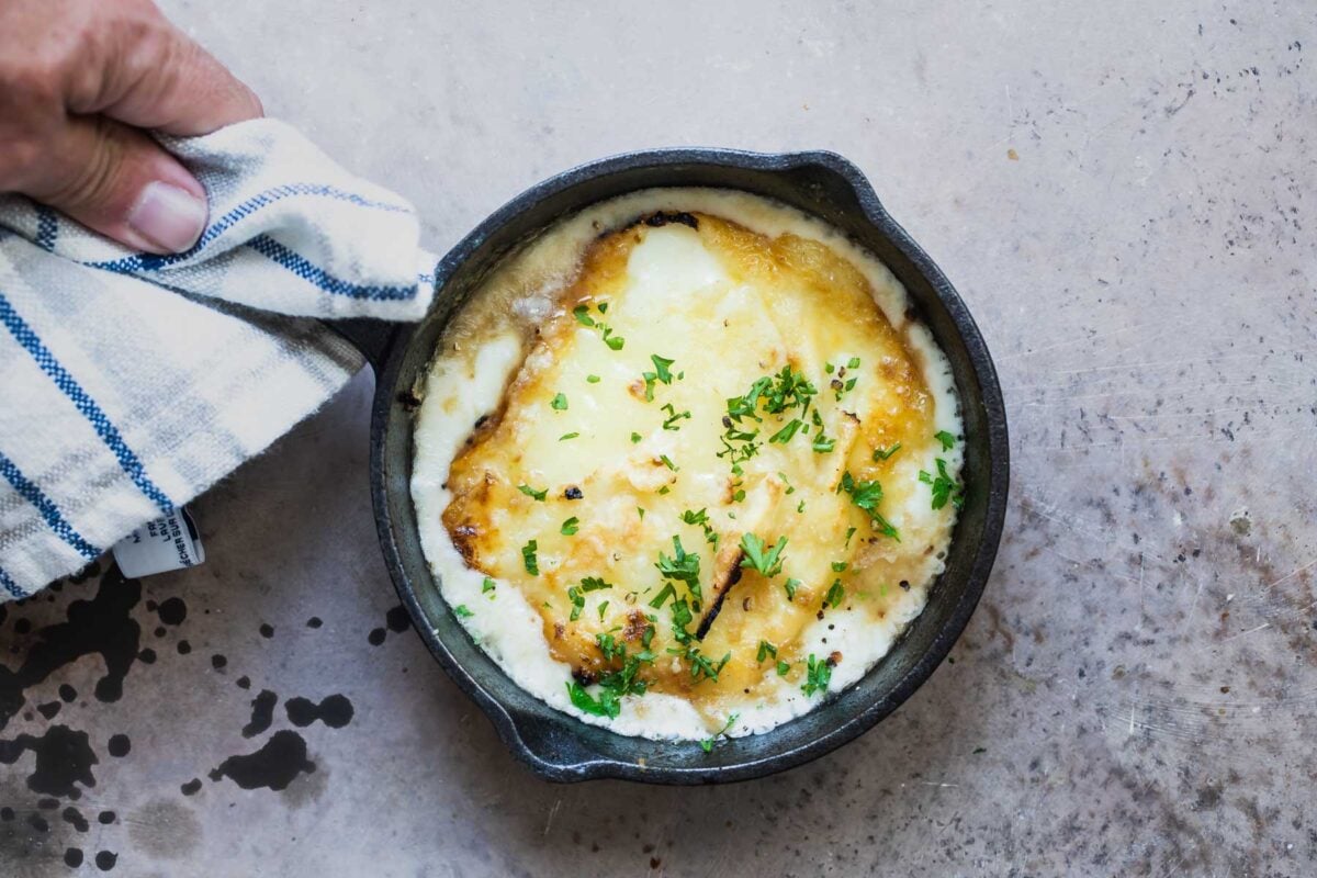 Saganaki in a small cast iron pan.