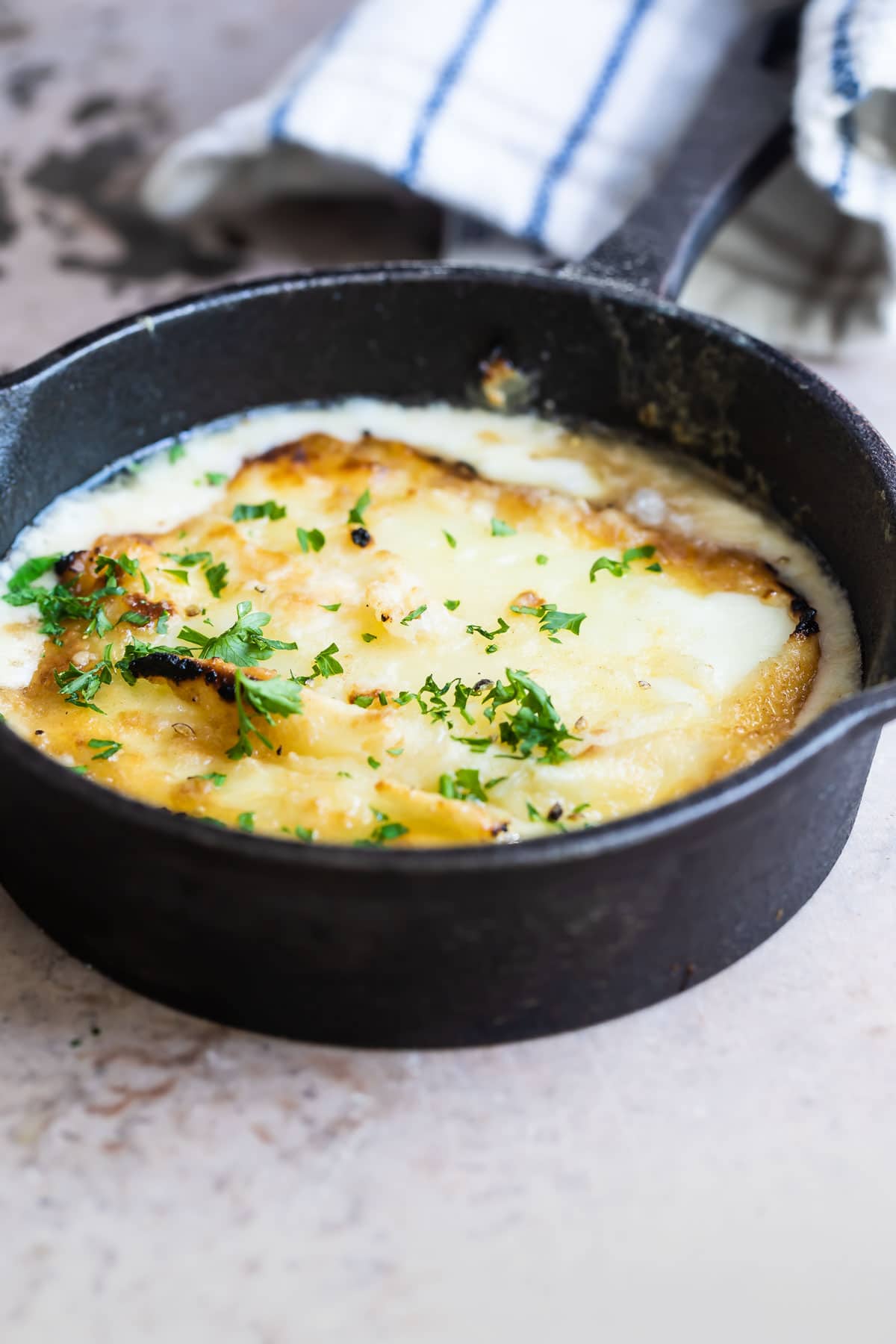 Saganaki in a small cast iron pan.