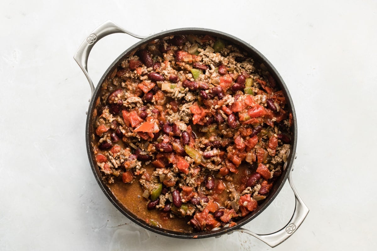 Beef chili in a black pot.