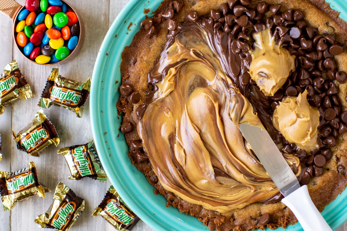 Building a chocolate chip cookie cake.