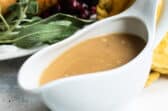 Turkey gravy in a white gravy boat.