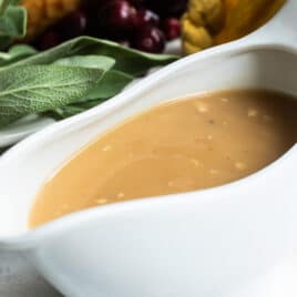 Turkey gravy in a white gravy boat.