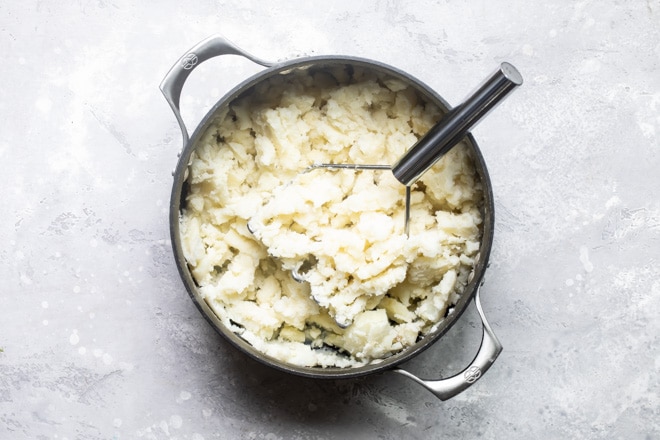 A pan full of mashed potatoes.