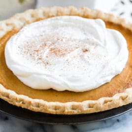 Make ahead pumpkin pie topped with whipped cream.