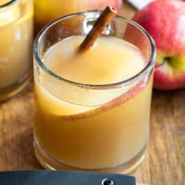 Apple cider in a clear glasses.