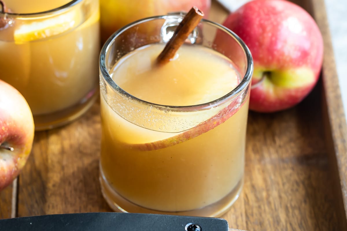 Apple cider in a clear glasses.