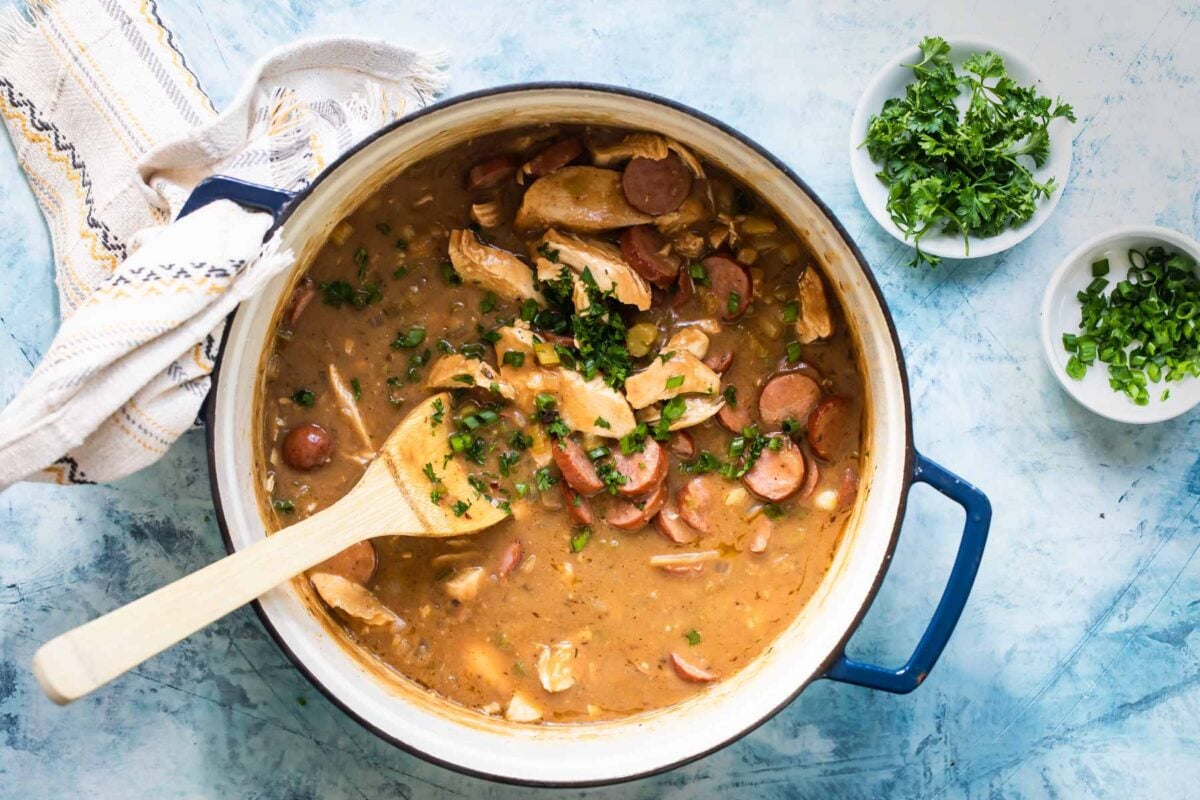 Chicken gumbo being cooked in a Dutch oven.