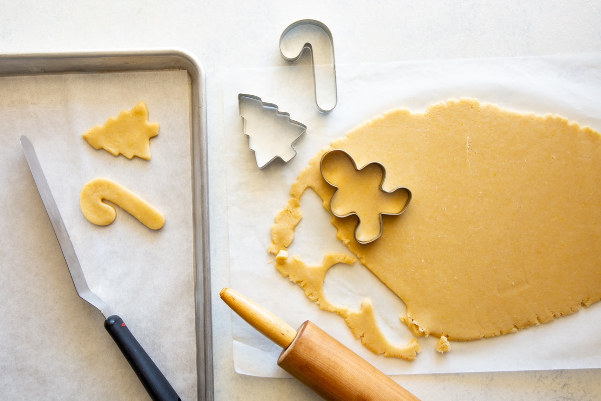 Sugar cookie dough rolled out to make Christmas cookies.