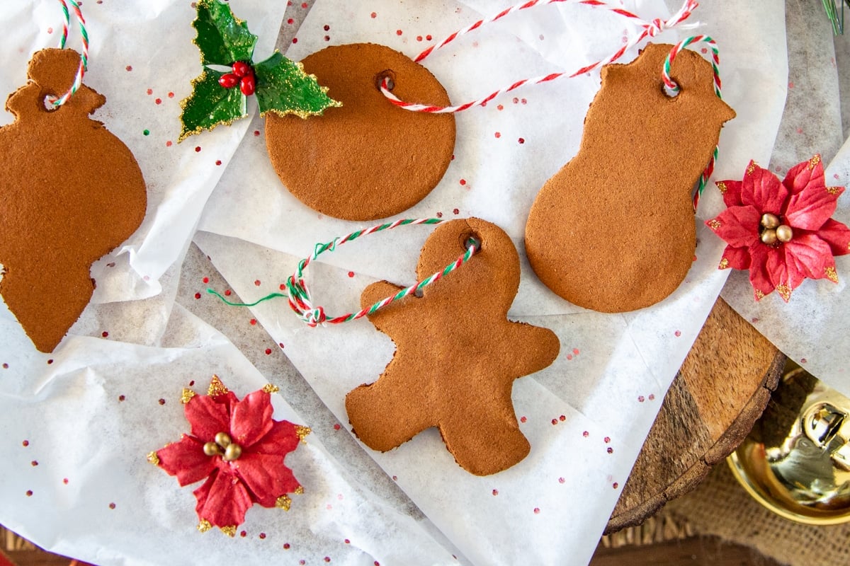 Cinnamon ornaments on white tissue paper.