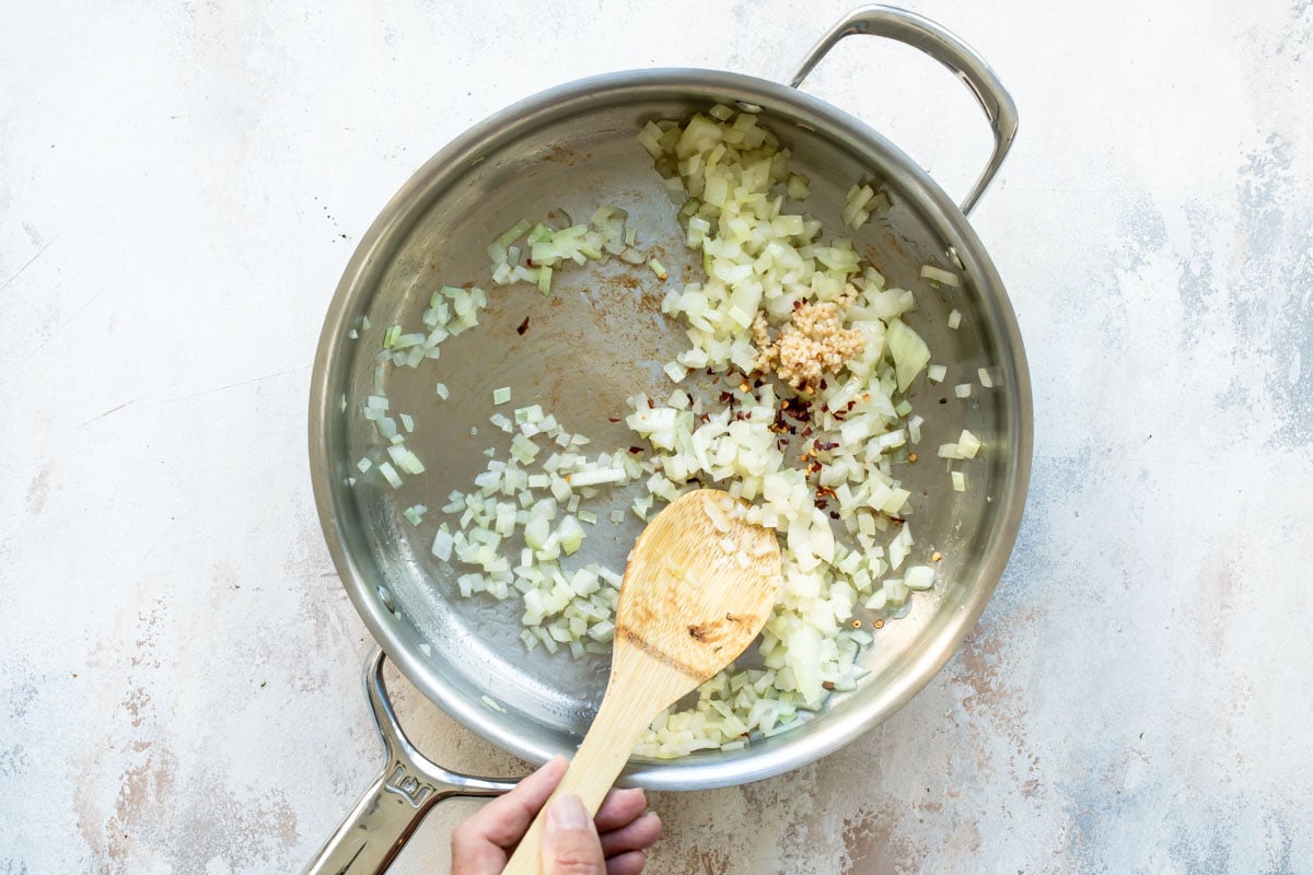 A skillet with cooked onions.