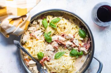 A skillet of creamy chicken pasta.