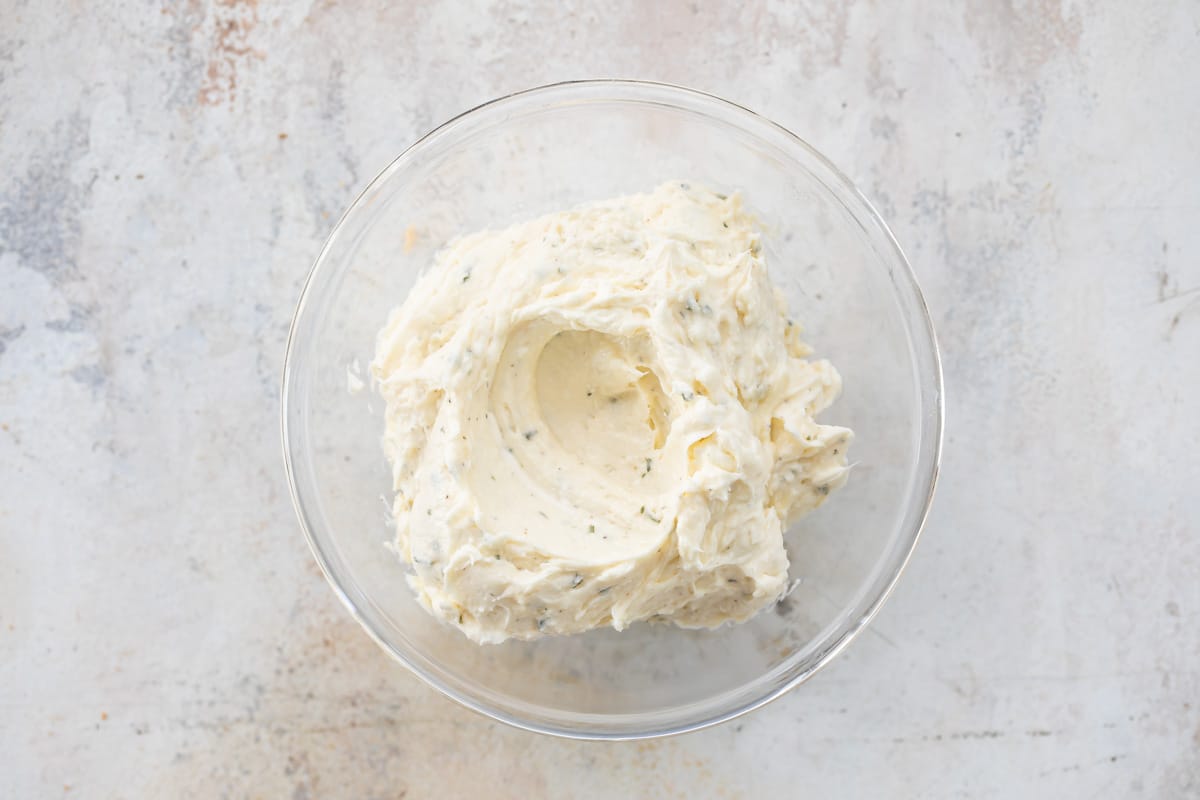 Cucumber sandwich spread in a clear bowl.