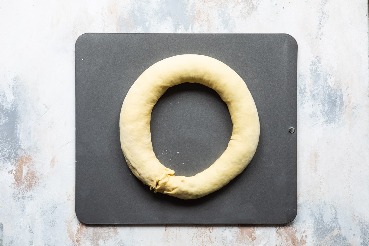 King cake dough on a baking sheet.