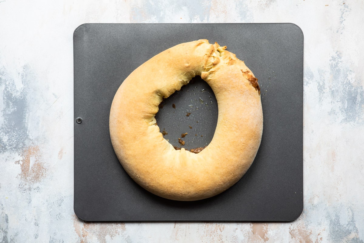 A king cake on a baking sheeet.