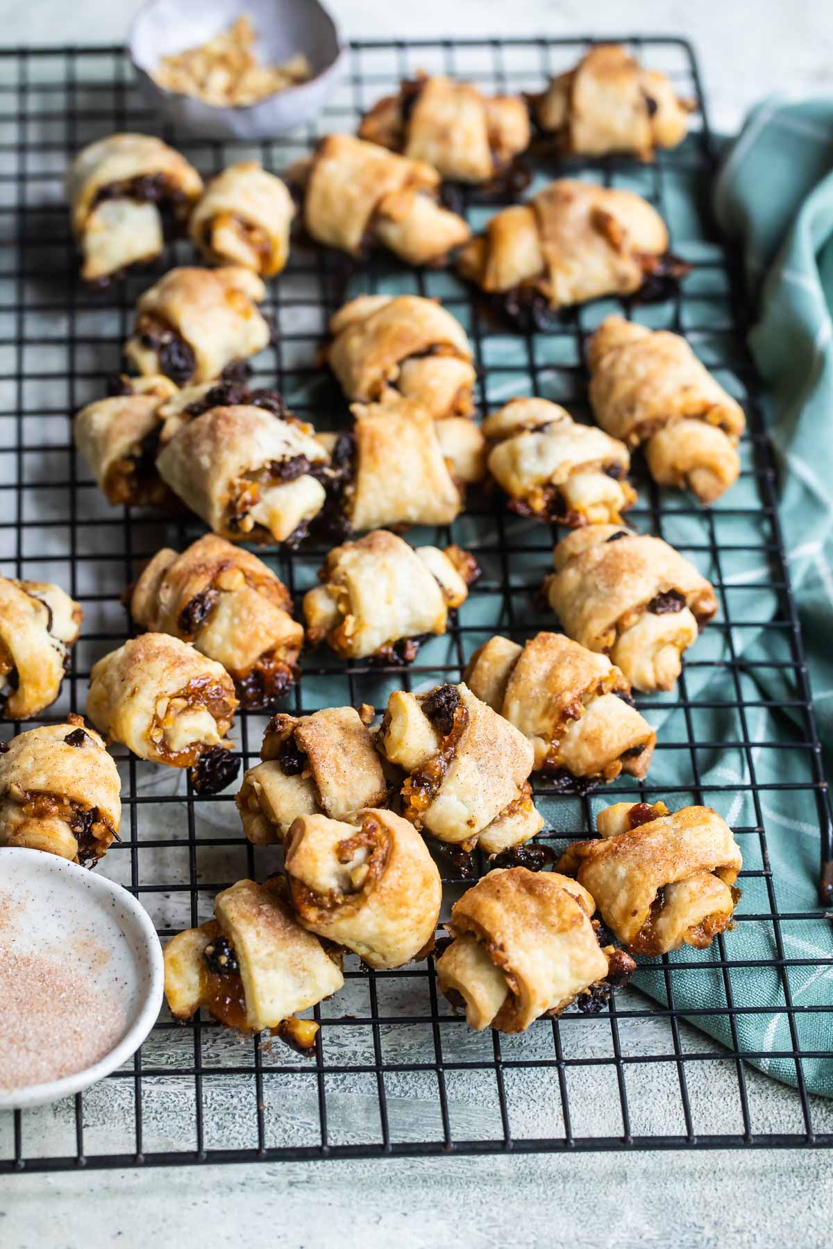 Baked rugelach on a cooling rack.
