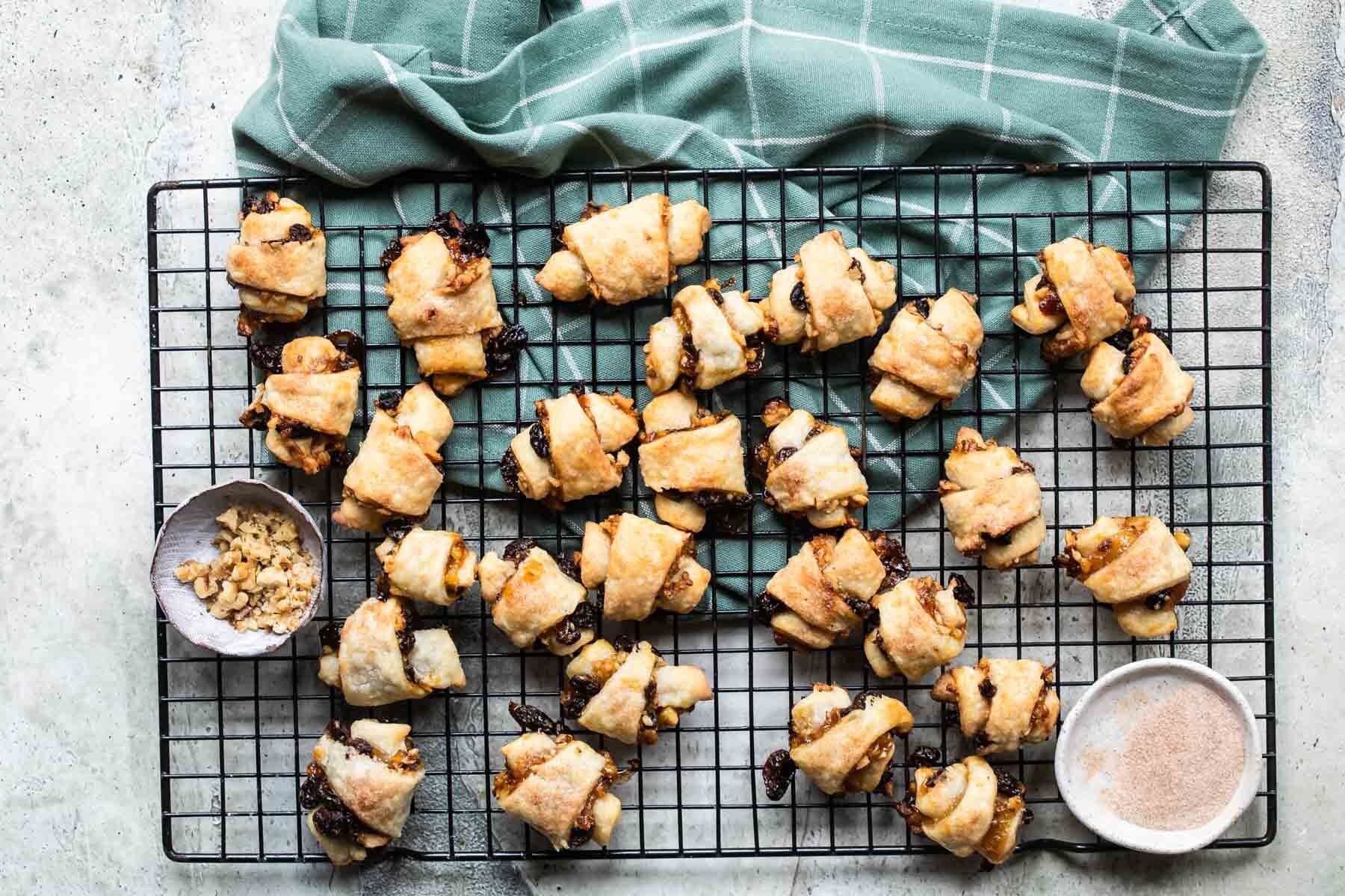 Baked rugelach on a cooling rack.