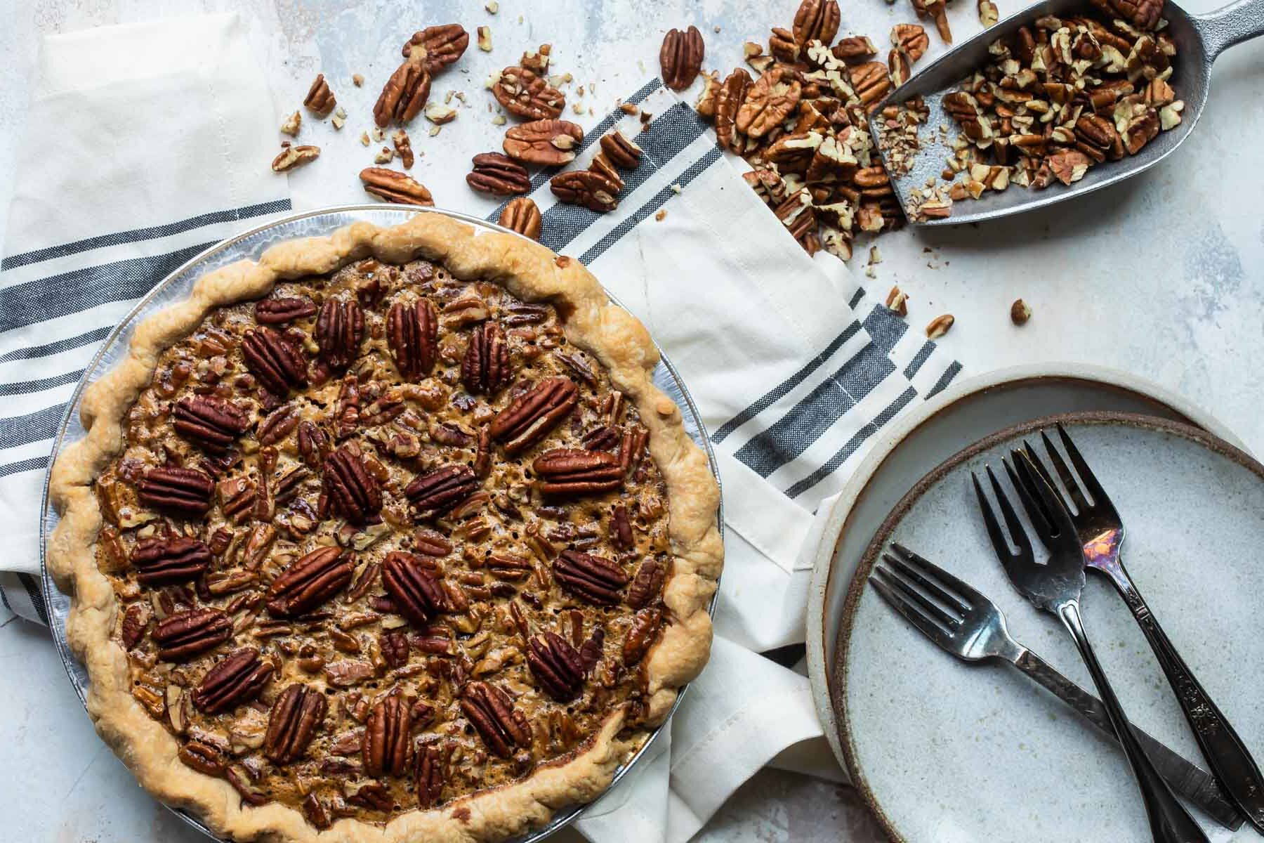 A baked pecan pie (unsliced).
