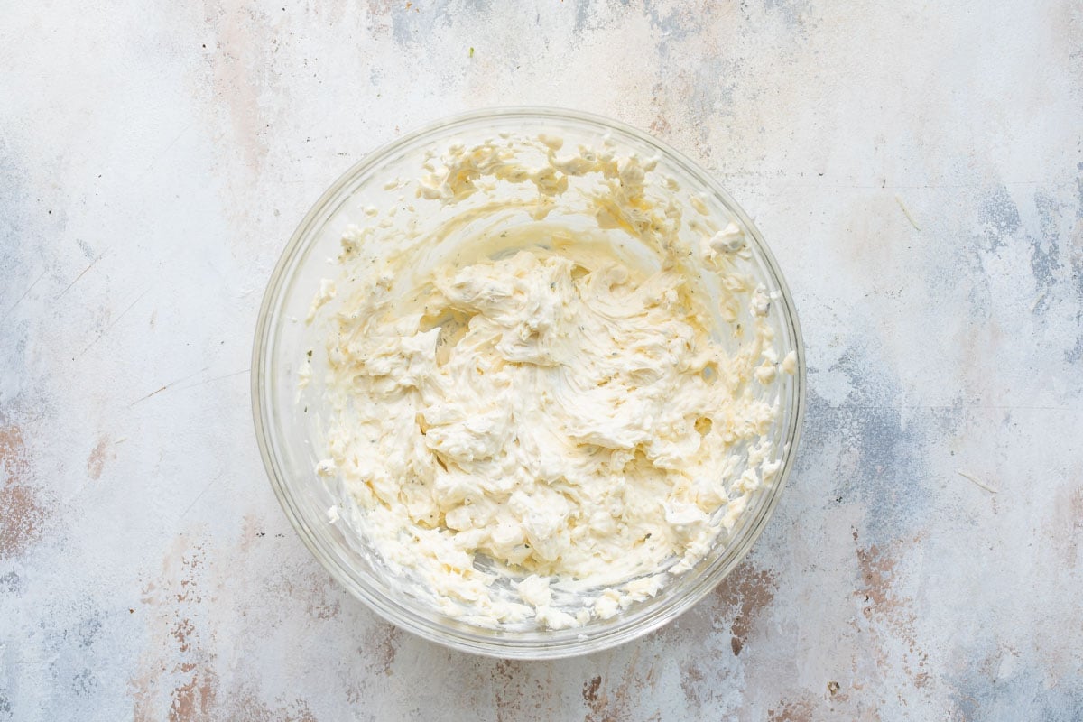Cream cheese mixture in a clear bowl.