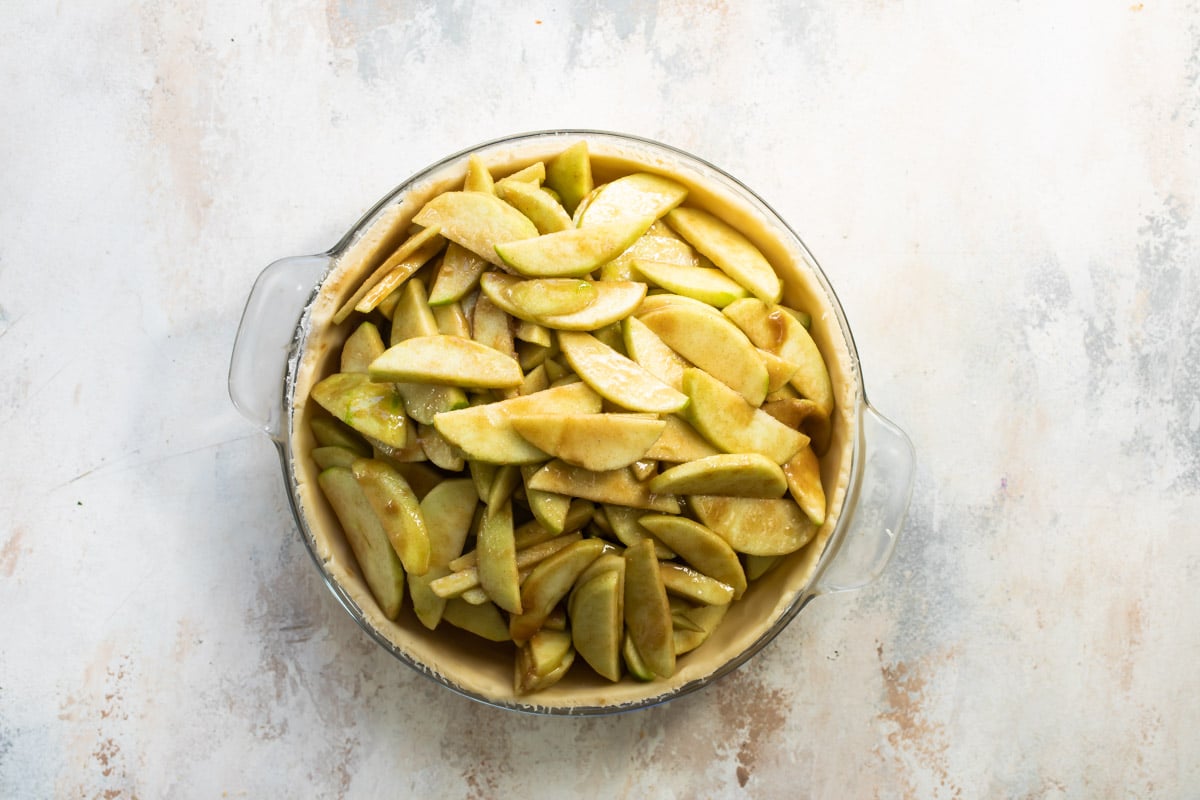 Apple pieces in a pie crust.
