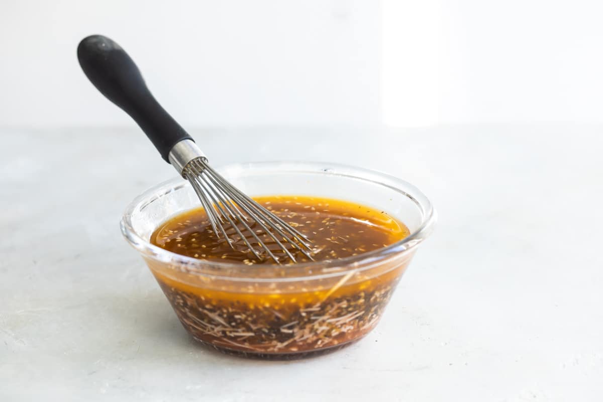 California pasta salad dressing in a ramekin.