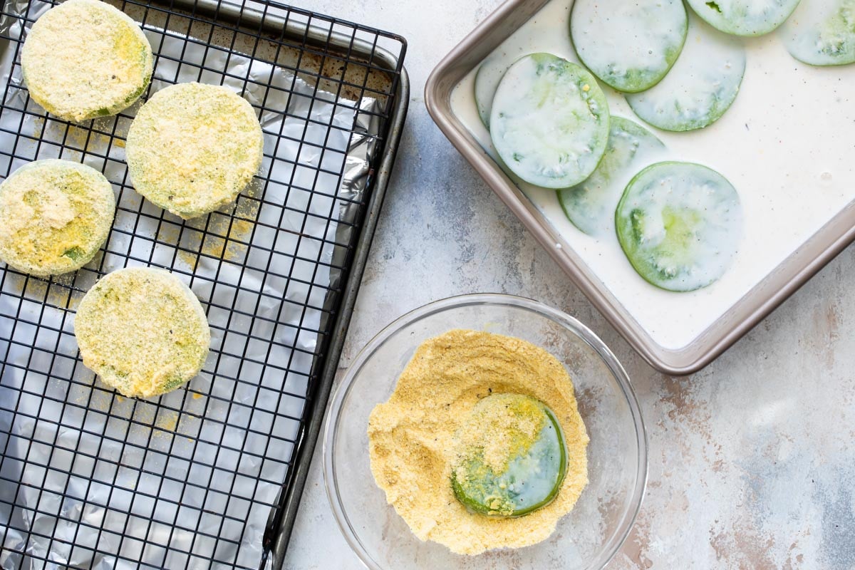 Soaking green tomatoes in buttermilk for Fried Green Tomatoes.