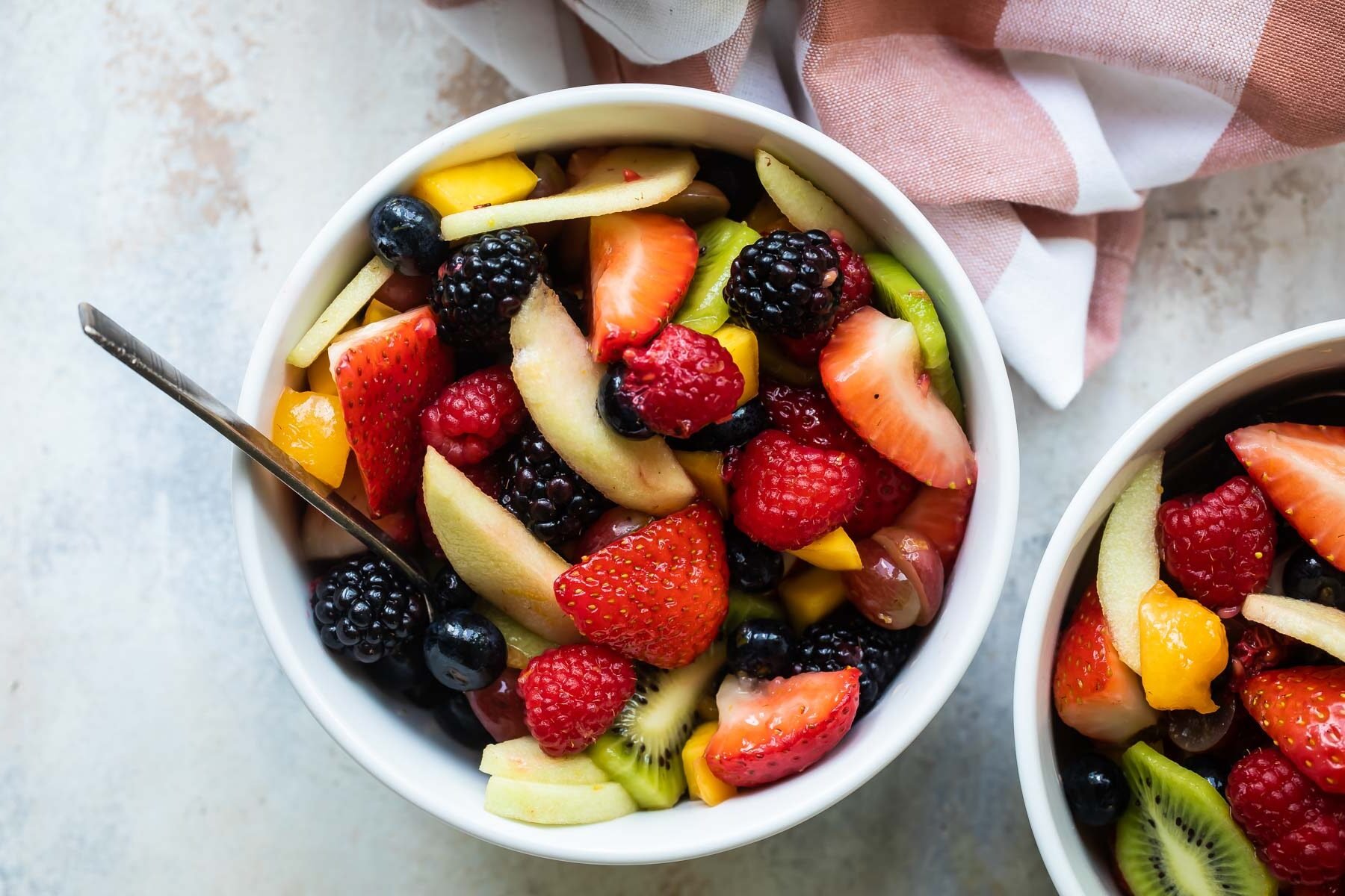 Two bowls of fruit salad.