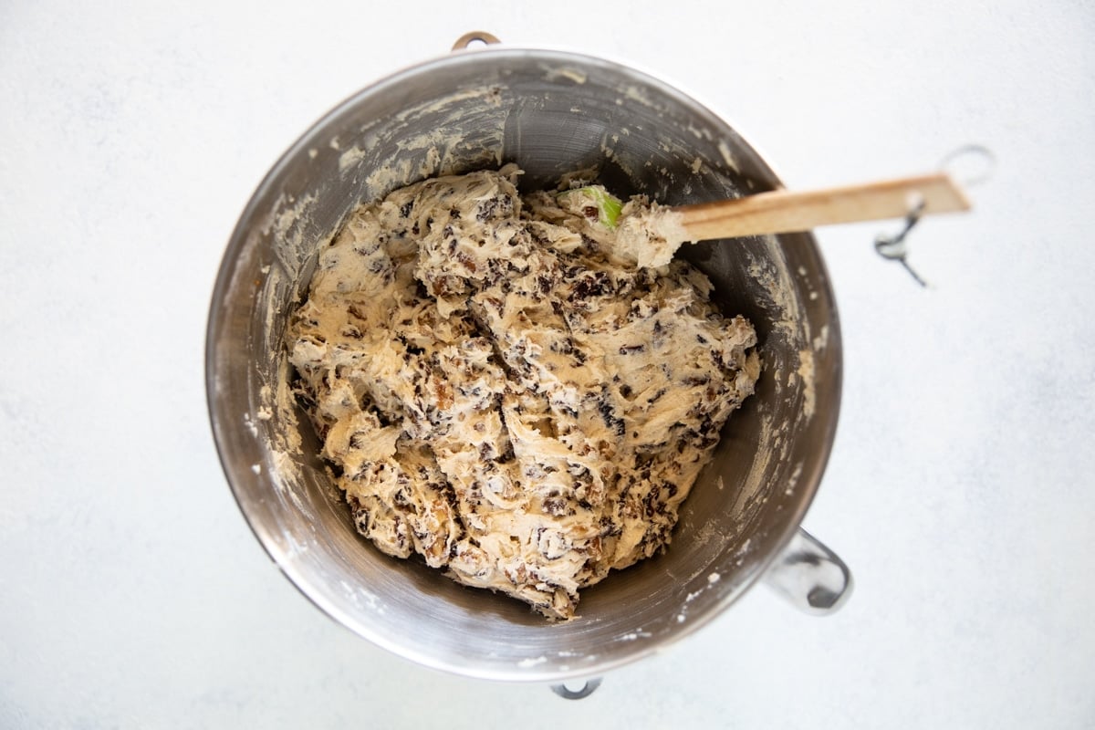 Fruitcake cookie batter in a mixing bowl.