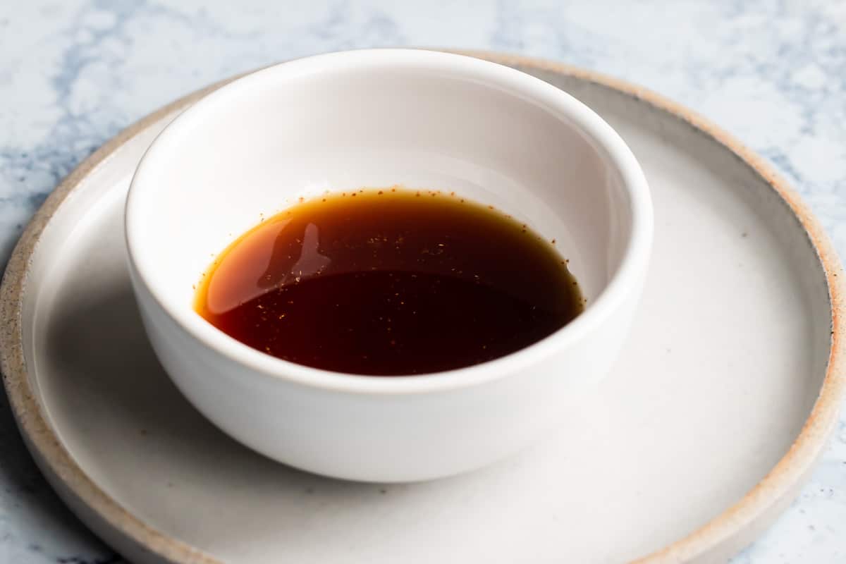 A bowl of marinade for Midwest Pepper Steak.
