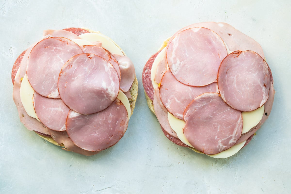An assembled muffaletta before being cooked.