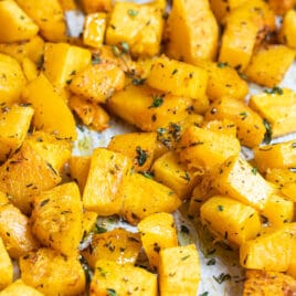 Roasted butternut squash on a baking sheet.