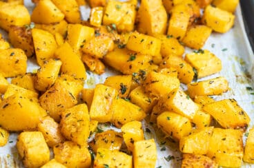 Roasted butternut squash on a baking sheet.