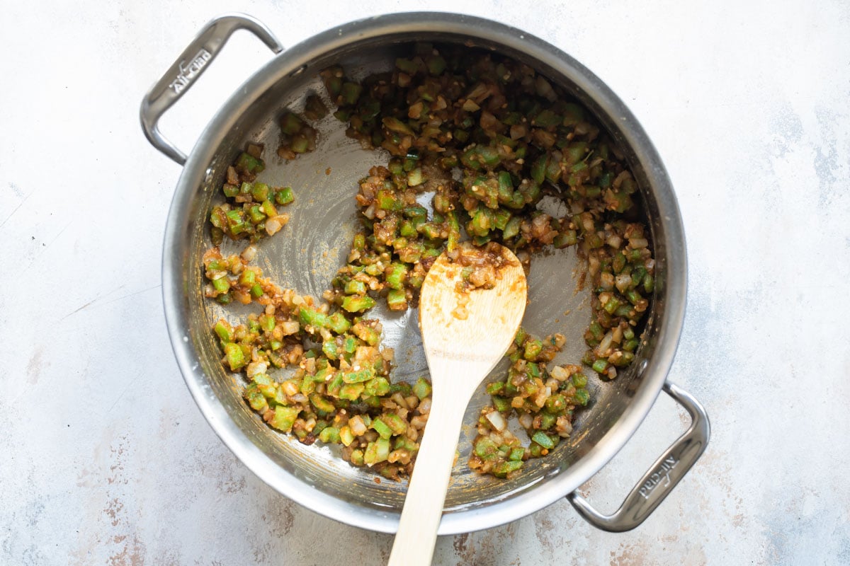 Shrimp etouffee being cooked in a silver pot.