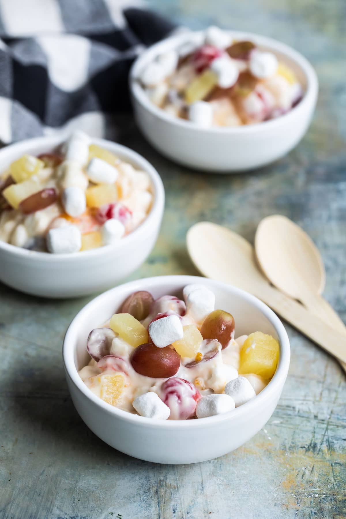 Three small bowl with 24 hour fruit salad.