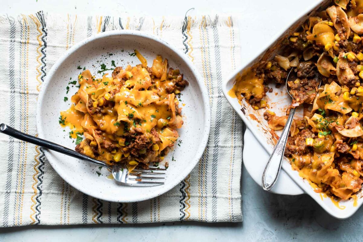 A serving of beef noodle casserole on a white plate.