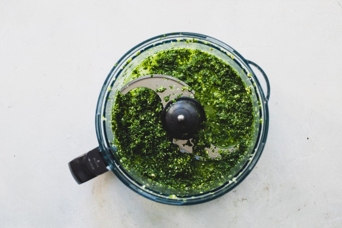 A food processor full of Cilantro Mint Sauce.