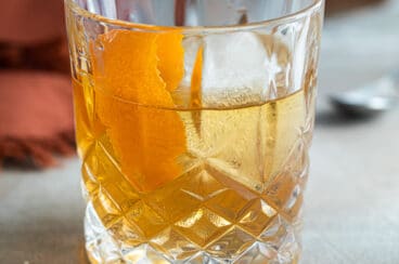 An Old Fashioned cocktail in a rocks glass.