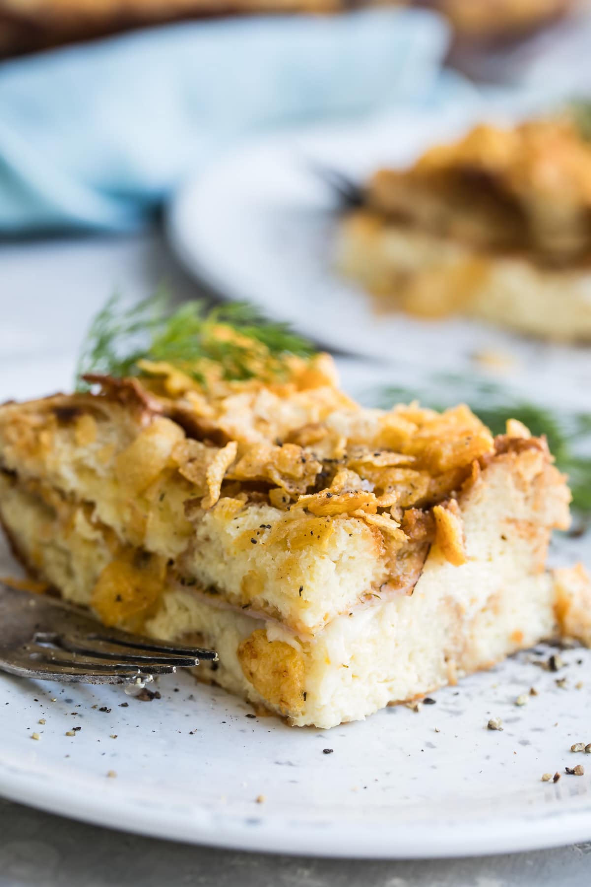 Overnight breakfast casserole on a white plate.