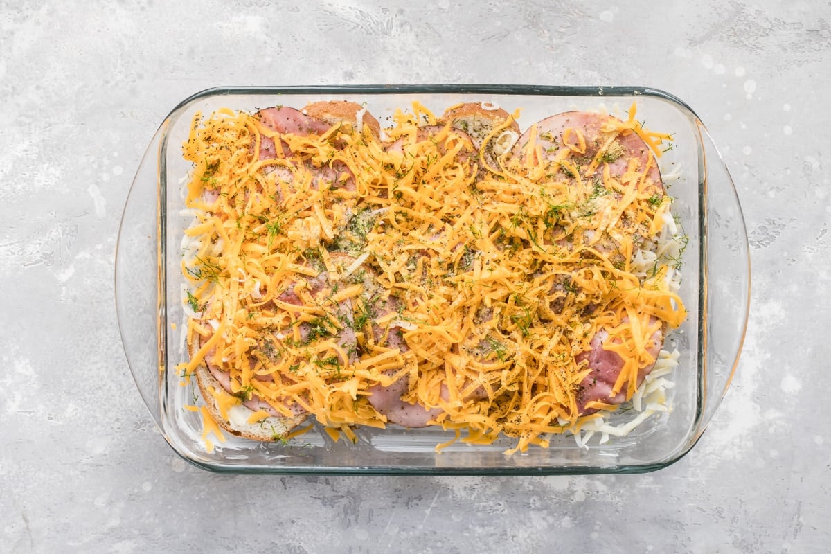 Overnight breakfast casserole prebaked in a glass baking dish.