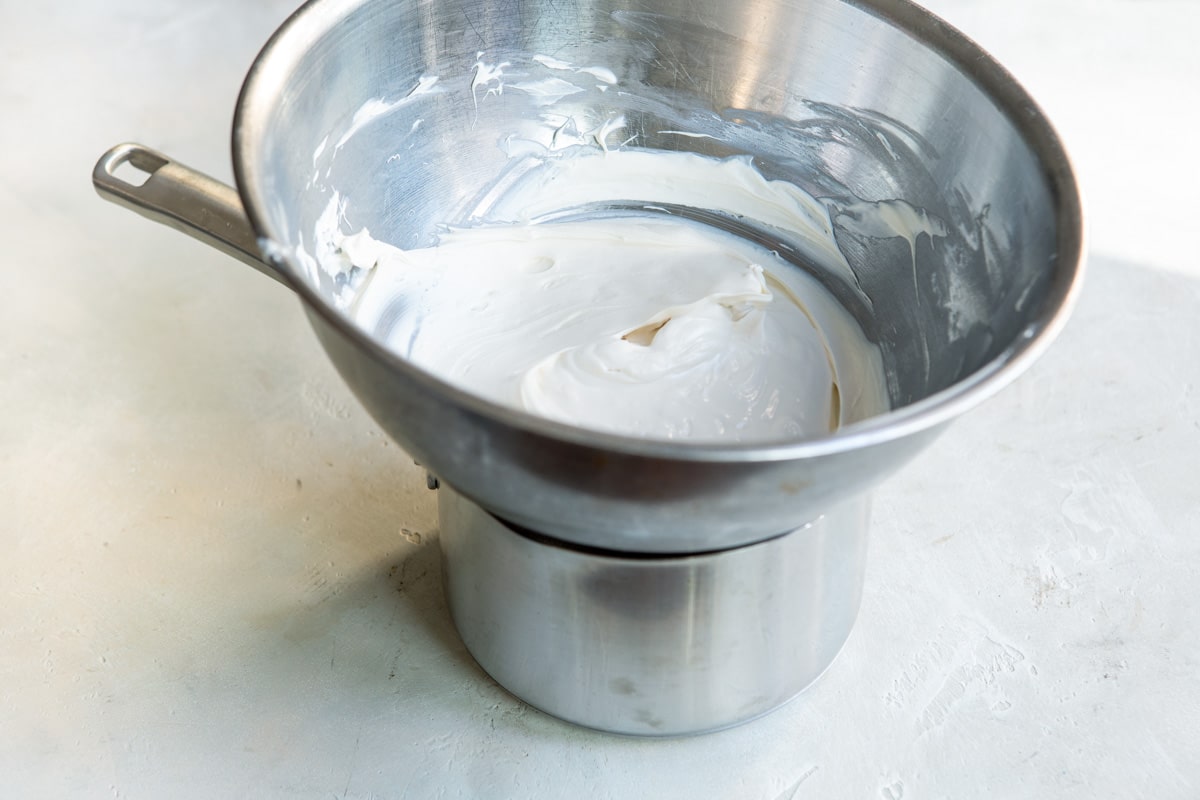 White melted chocolate over a double boiler.