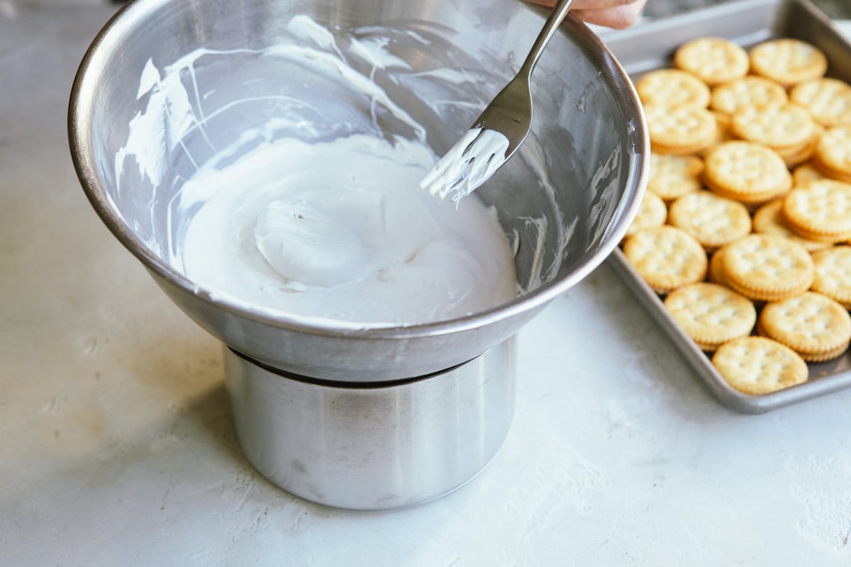 White melted chocolate over a double boiler.