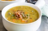 Split pea soup in a white bowl.