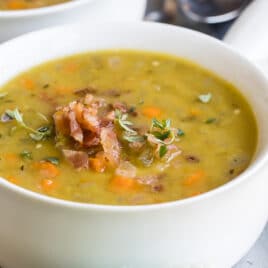 Split pea soup in a white bowl.