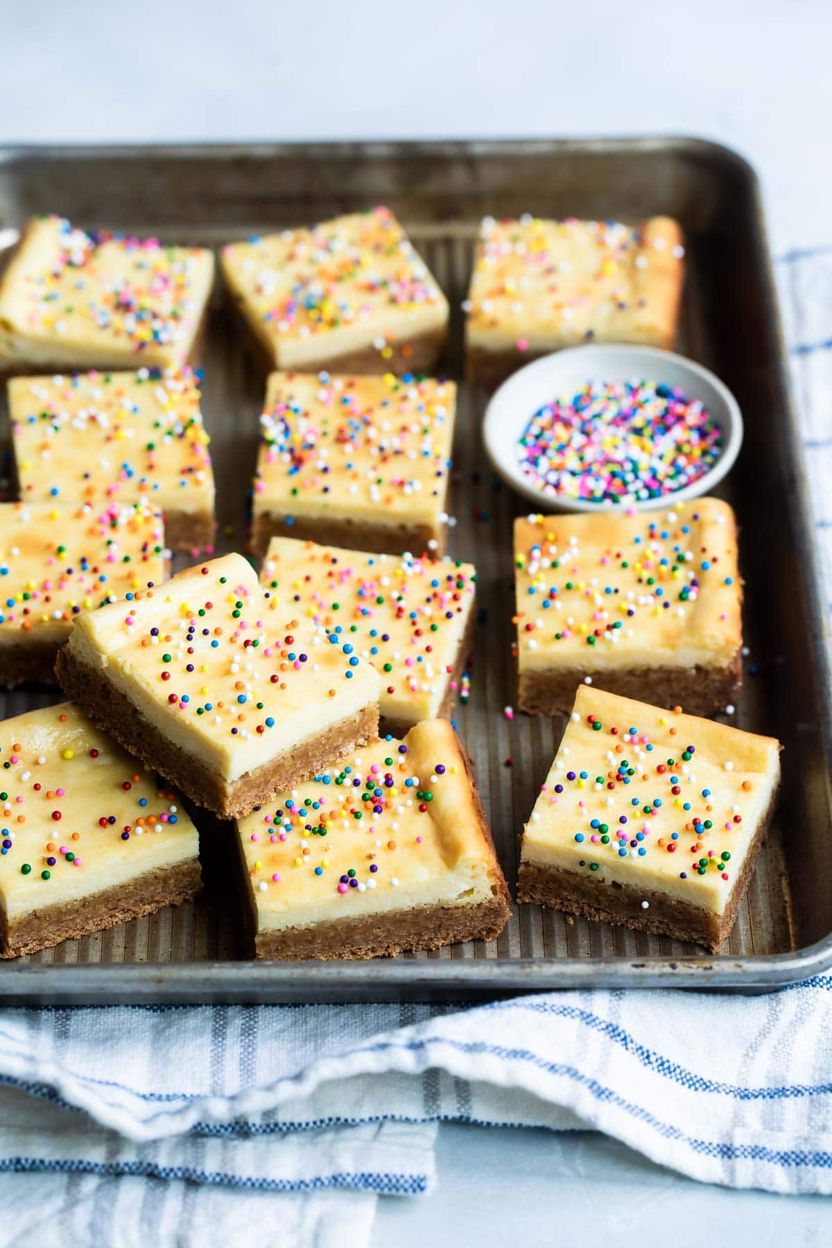 A pan filled with sugar cookie bar squares.