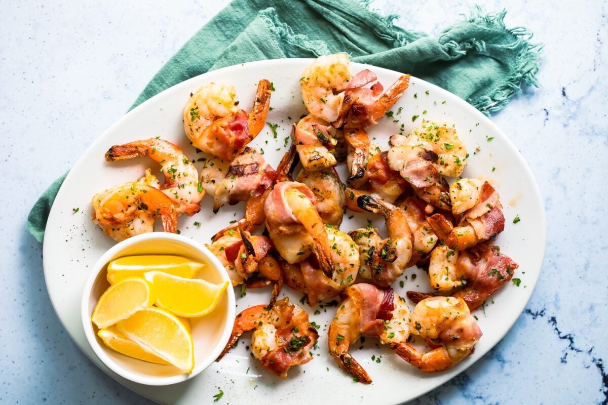 Bacon wrapped shrimp on a serving platter.