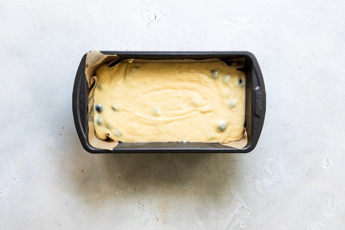 A loaf of blueberry lemon yogurt cake batter before being baked.