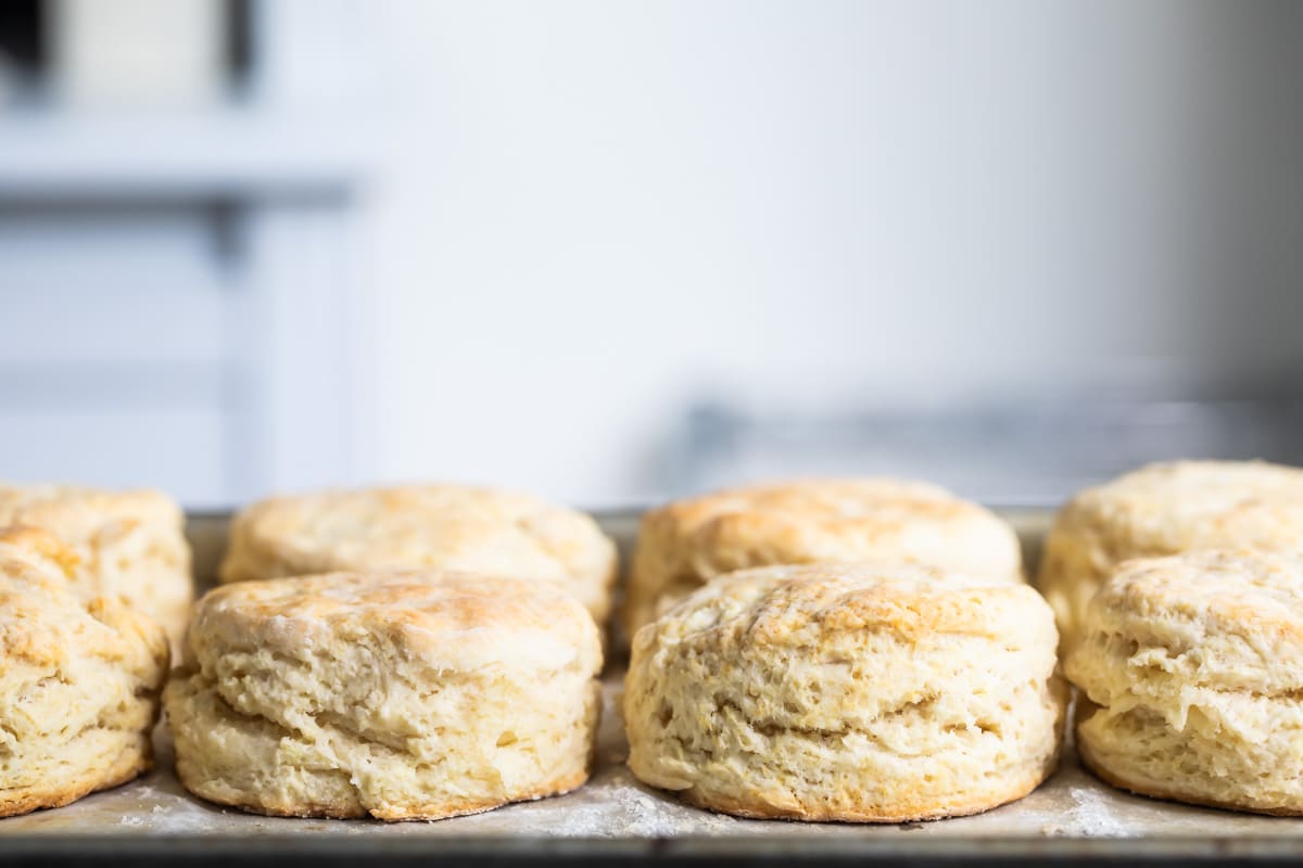 Buttermilk biscuits on a board.