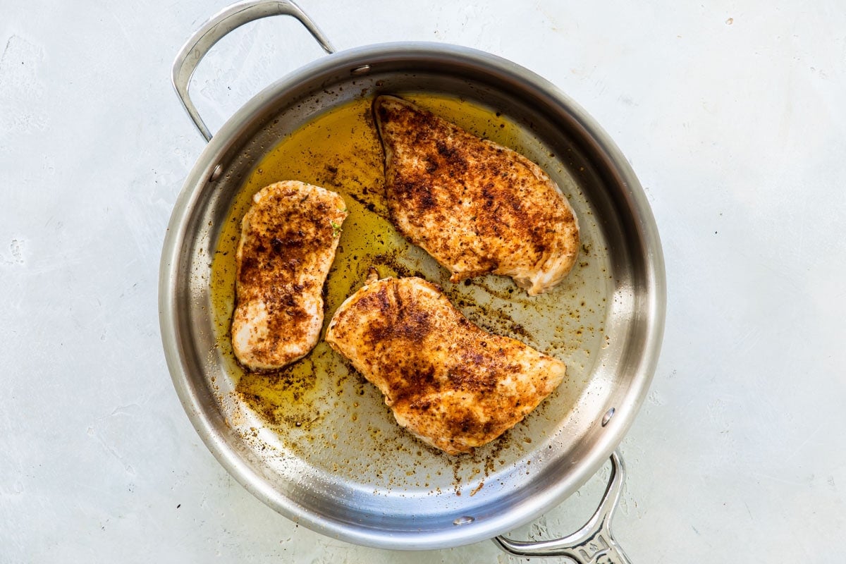 Cajun chicken in a skillet.